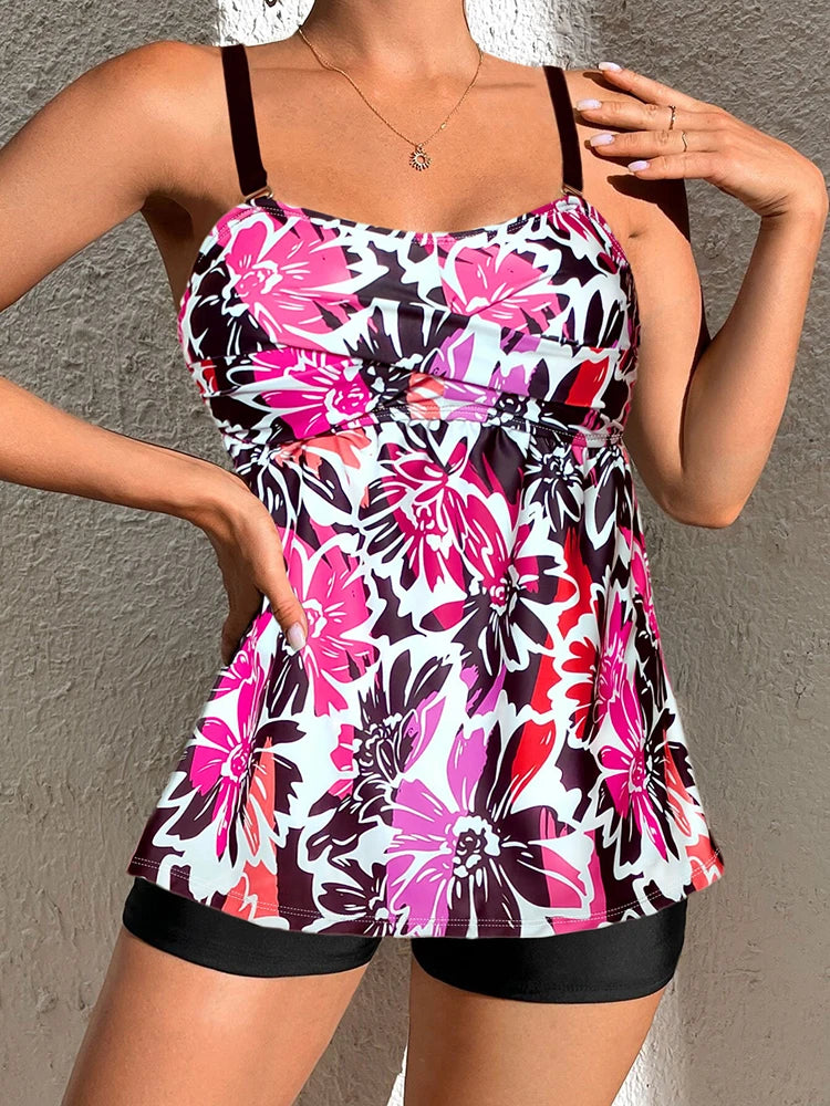 Maillot de bain rose avec motifs de fleur et bretelles noires 